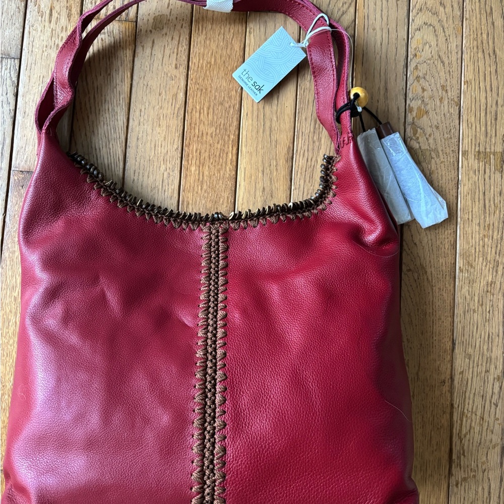 The Sak Red Leather Shoulder Bag with Whipstitch Trim